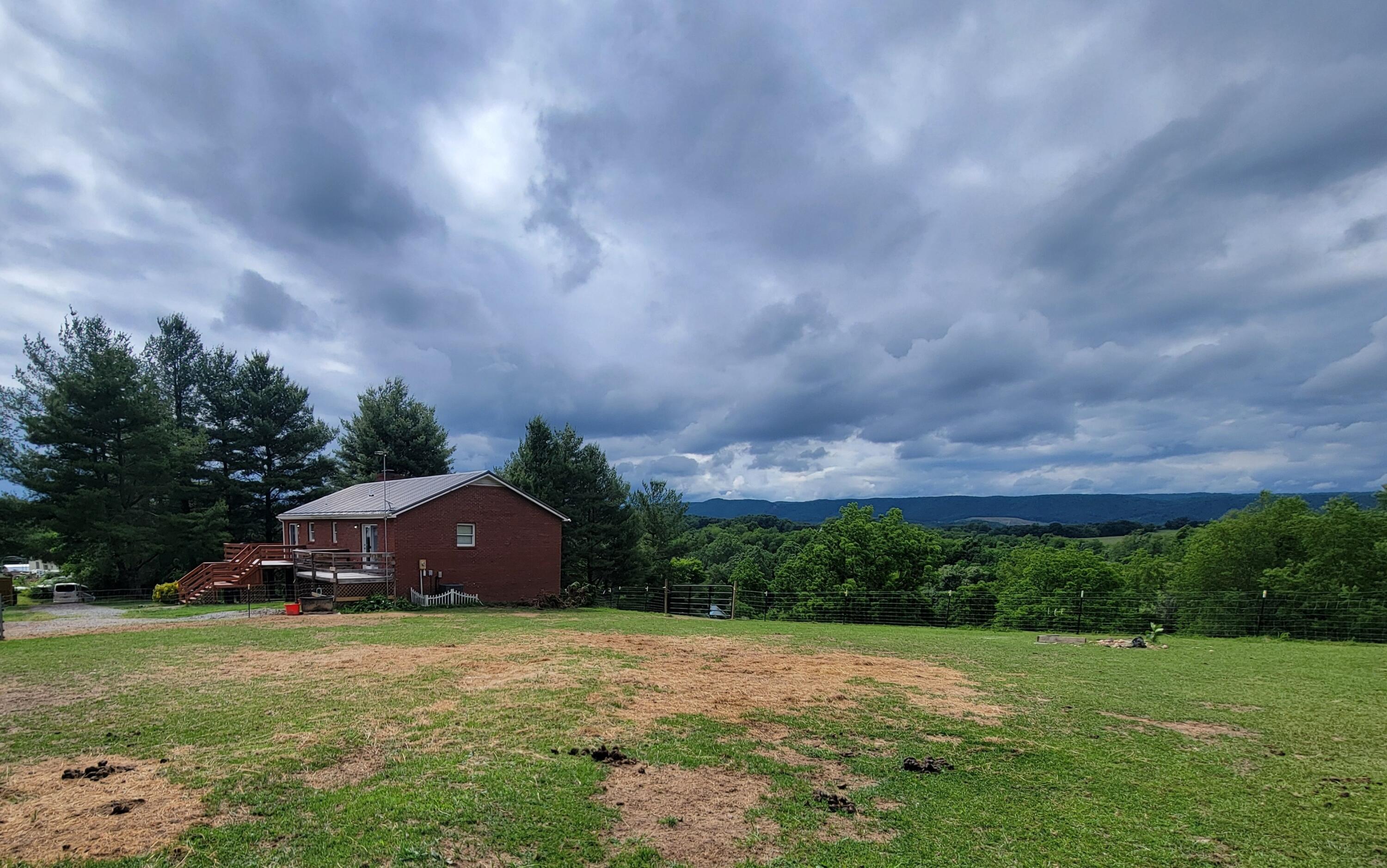 6260 Highland Road Dublin, VA 24084 - Photo 5 of 38 a big yard with lots of green space and plants