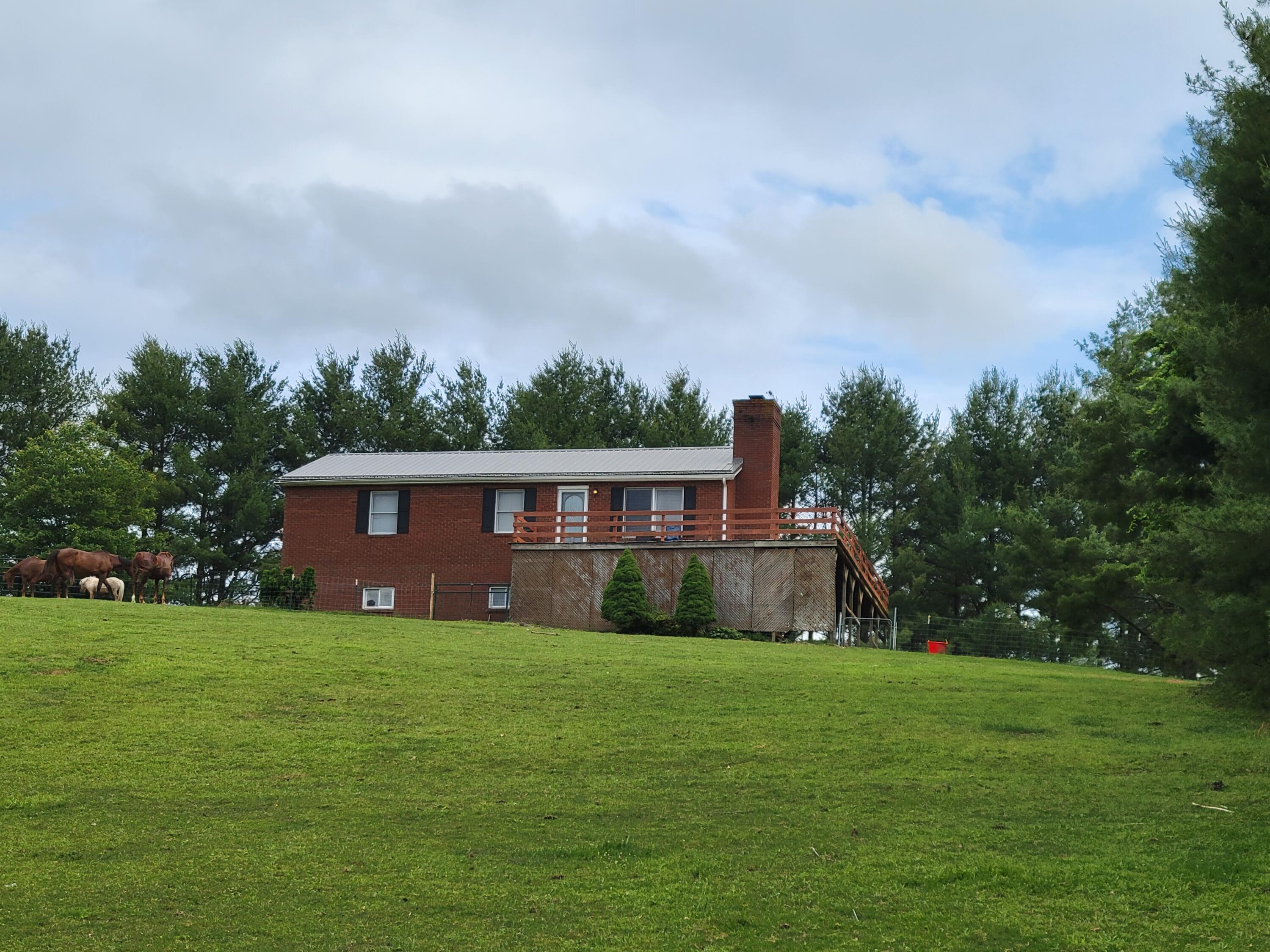 6260 Highland Road Dublin, VA 24084 - Photo 8 of 38 a view of a house with a yard