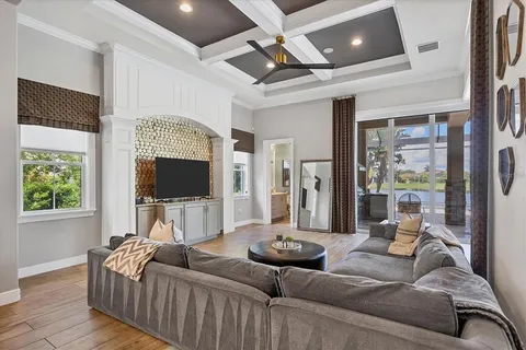 a bathroom with a granite countertop tub a sink and a window