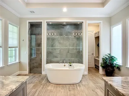 a bathroom with a toilet sink a shower and a mirror