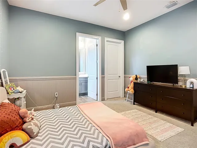 an aerial view of a house with a yard lake lake view and mountain view
