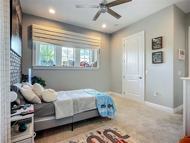 a view of a dining room with furniture large window and wooden floor