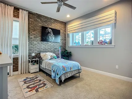 a view of a dining room with furniture large window and wooden floor