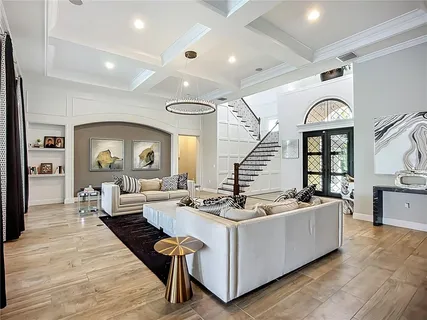 a large kitchen with a table and chairs in it