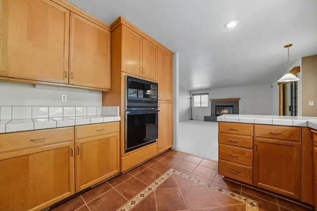 an aerial view of house with yard and swimming pool