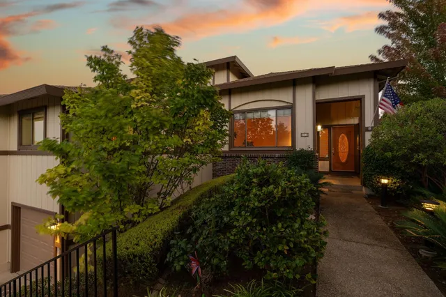 a view of a kitchen with a sink a refrigerator and a stove
