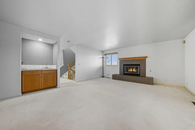 a bathroom with a sink a toilet and a window