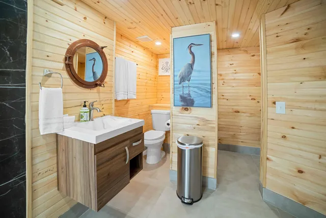 a bedroom with a bed and a chair