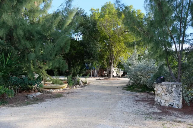 a bathroom with a glass door shower and a sink