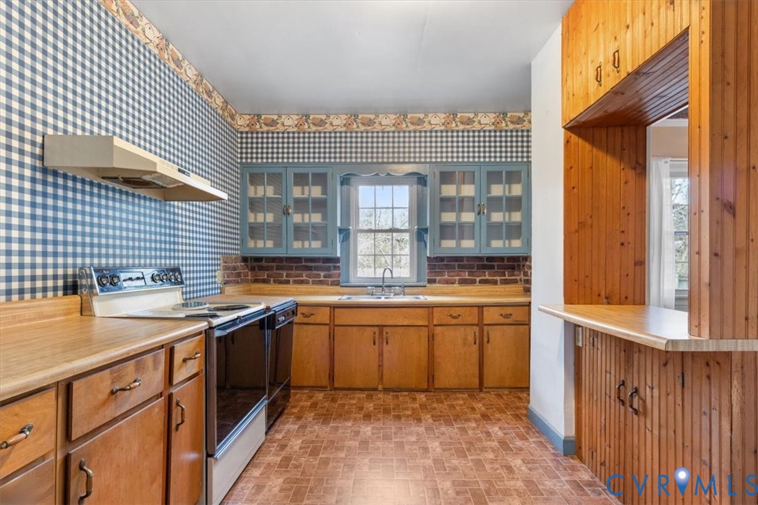 11221 Hanover Courthouse Road Hanover, VA 23069 - Photo 13 of 31 a kitchen with granite countertop a sink and cabinets