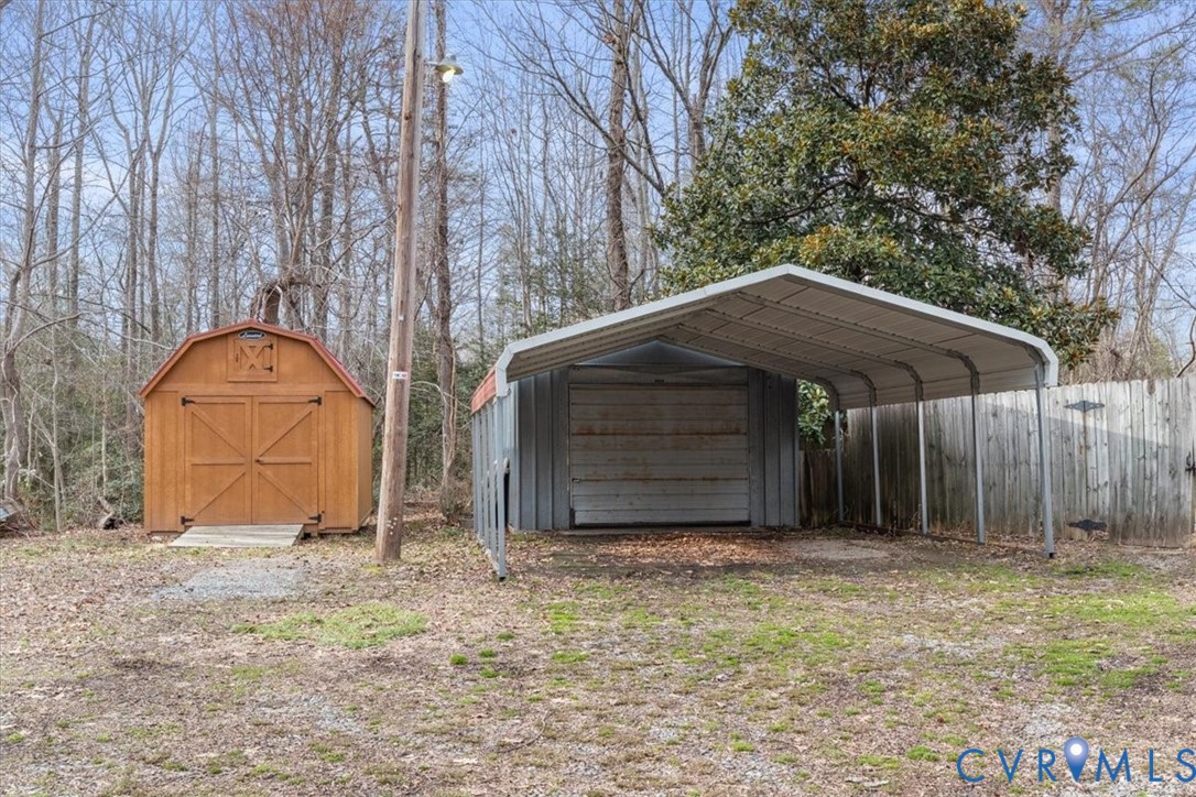 11221 Hanover Courthouse Road Hanover, VA 23069 - Photo 27 of 31 a backyard of house with a yard and garage