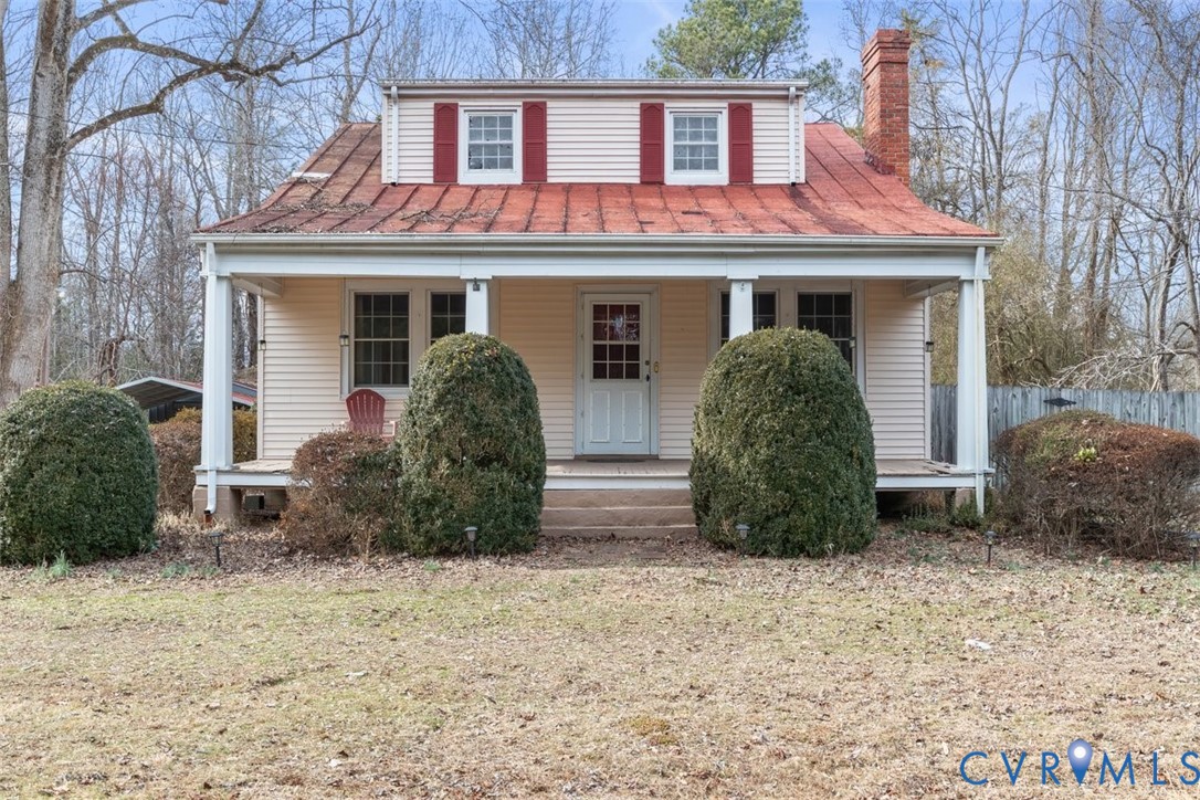 11221 Hanover Courthouse Road Hanover, VA 23069 - Photo 7 of 31 a view of a house with large windows and a yard