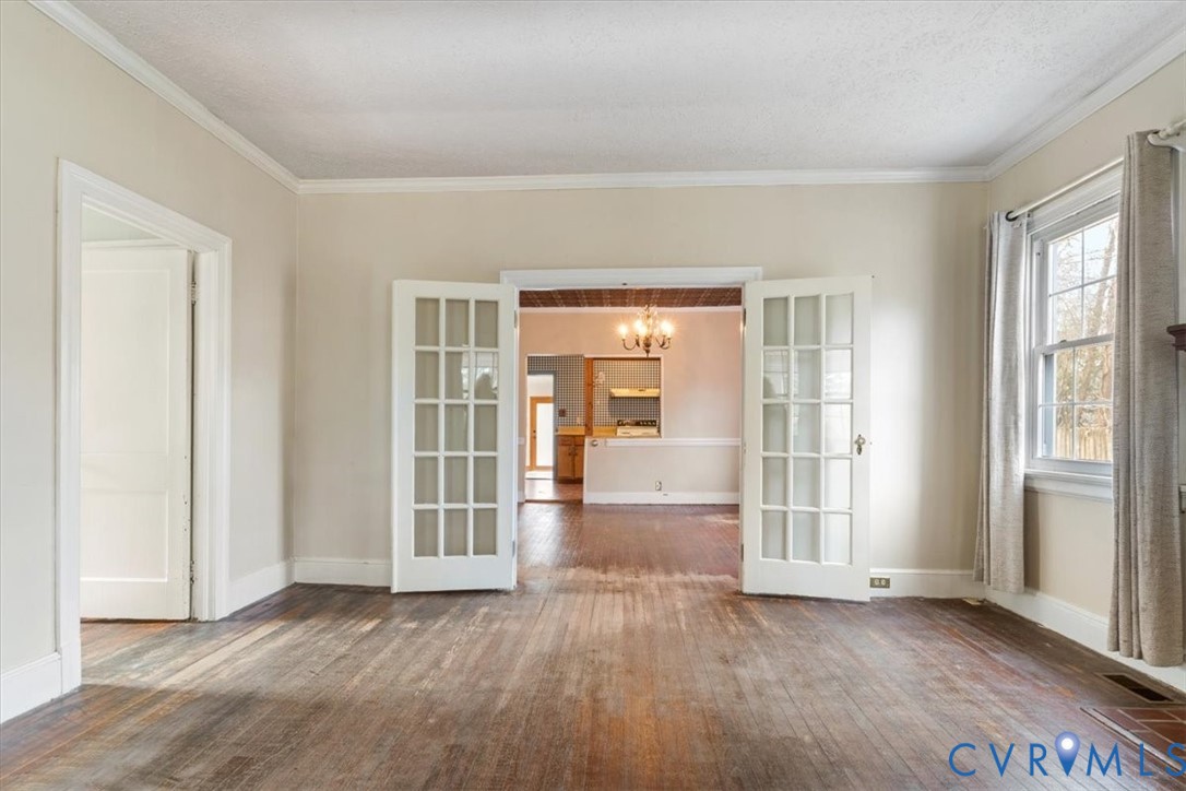 11221 Hanover Courthouse Road Hanover, VA 23069 - Photo 9 of 31 an empty room with wooden floor and windows