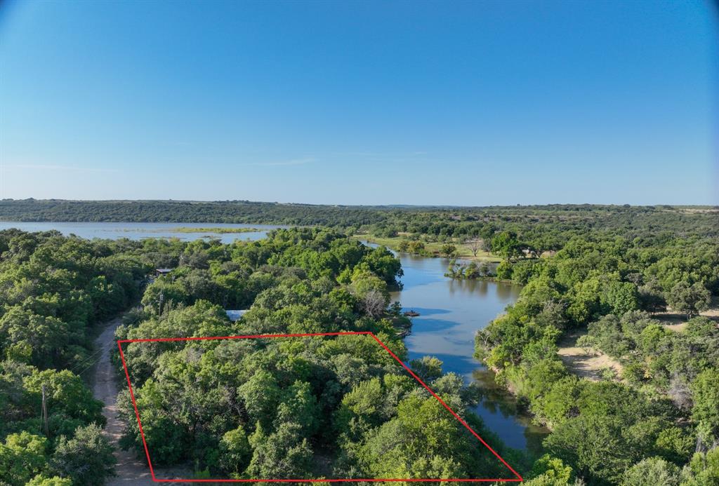 707 Trail End Clyde, TX 79510 - Photo 2 of 16 an aerial view of residential building and lake