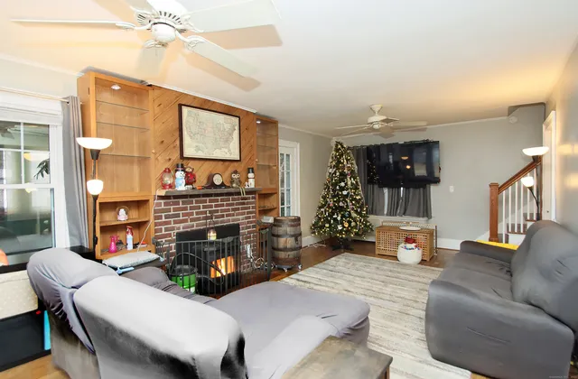 a living room with furniture and a fireplace