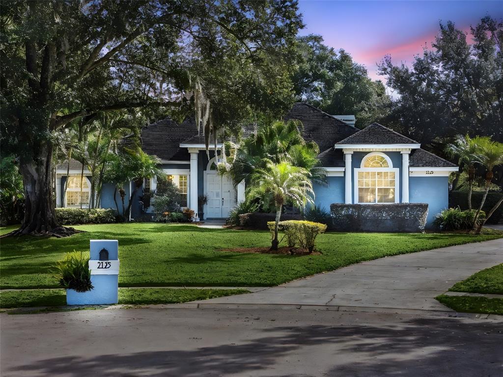 2125 Kane Park Way Windermere, FL 34786 - Photo 4 of 63 a front view of a house with a yard