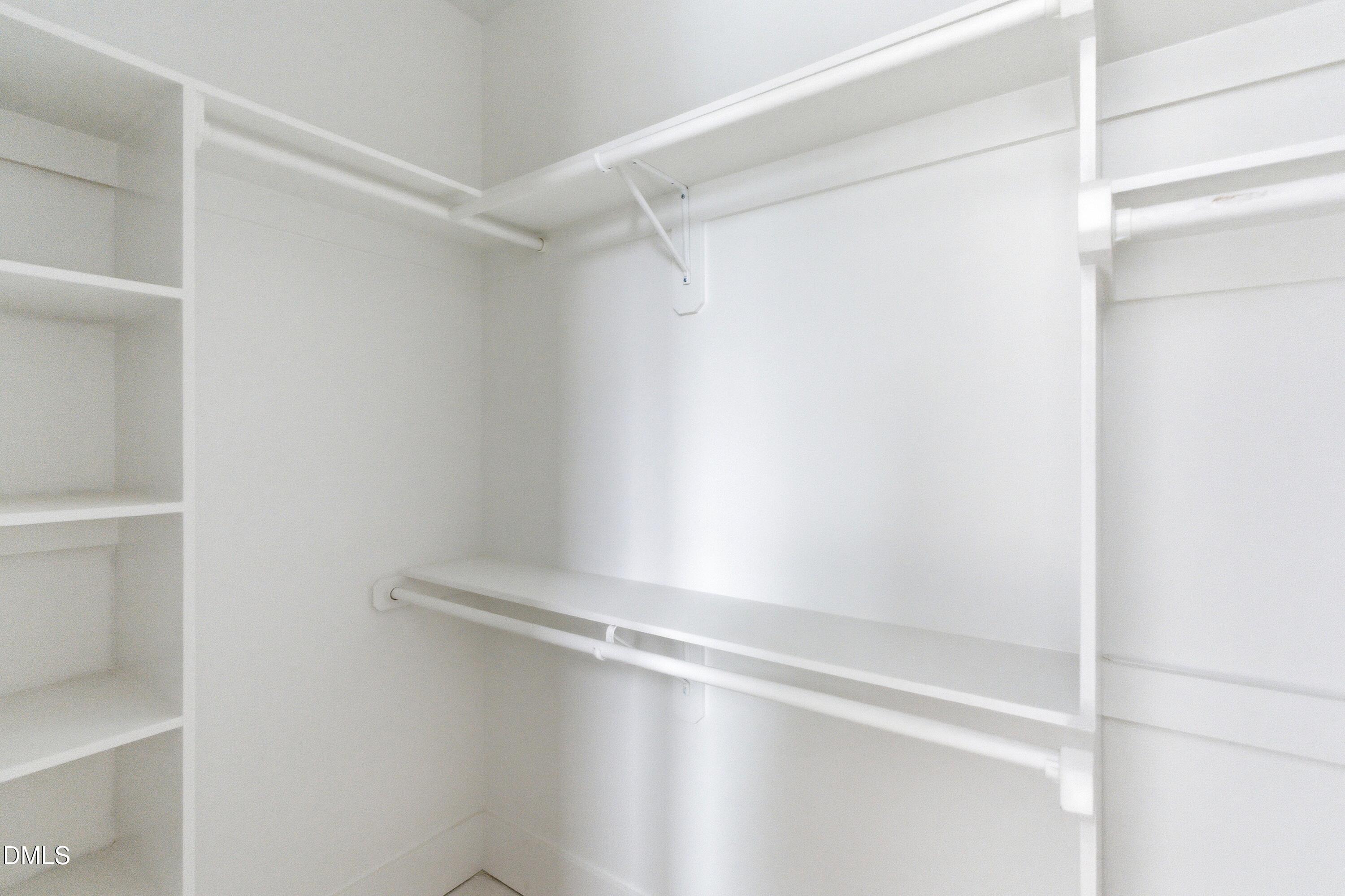 720 Noble Town Way, Unit 104 Raleigh, NC 27603 - Photo 17 of 21 Each bedroom suite comes with a spacious walk-in closet with custom built-ins and shelving