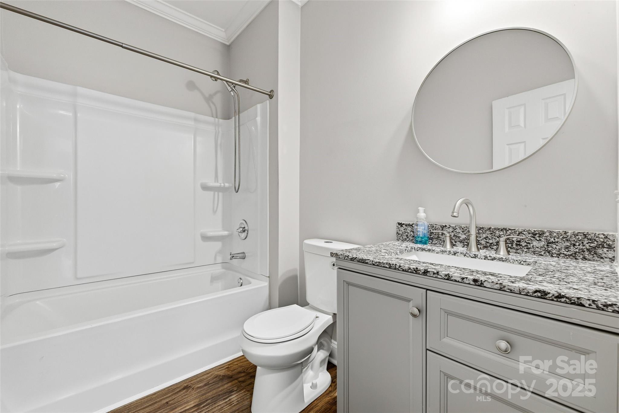 1257 Springdale Road Lancaster, SC 29720 - Photo 25 of 29 a bathroom with a granite countertop sink mirror vanity and toilet