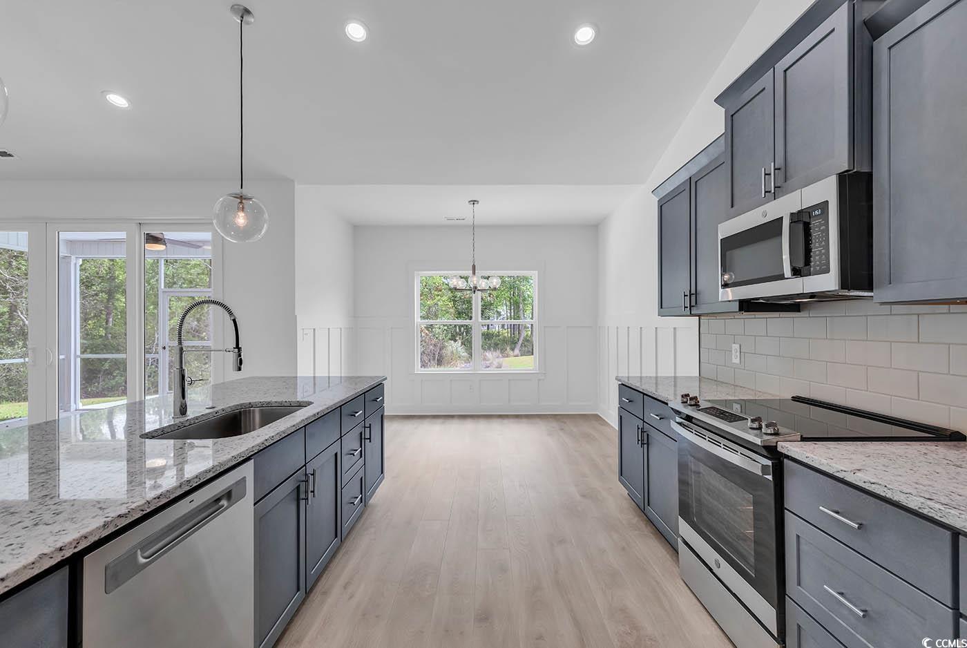 318 Dunbarton Lane Conway, SC 29526 - Photo 16 of 33 Kitchen with single-bowl sink, light wood laminate