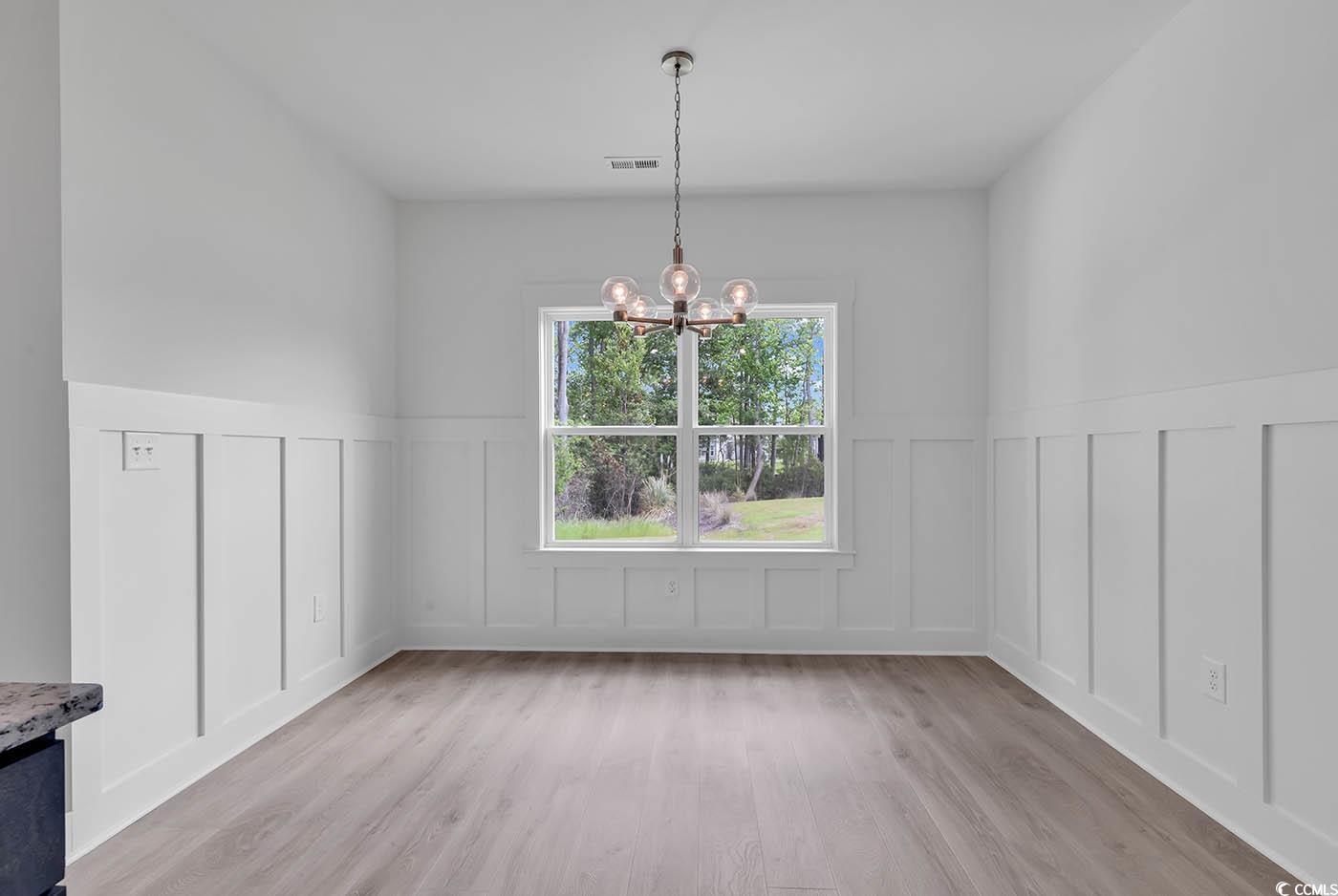 318 Dunbarton Lane Conway, SC 29526 - Photo 18 of 33 Dining area featuring an inviting chandelier and l