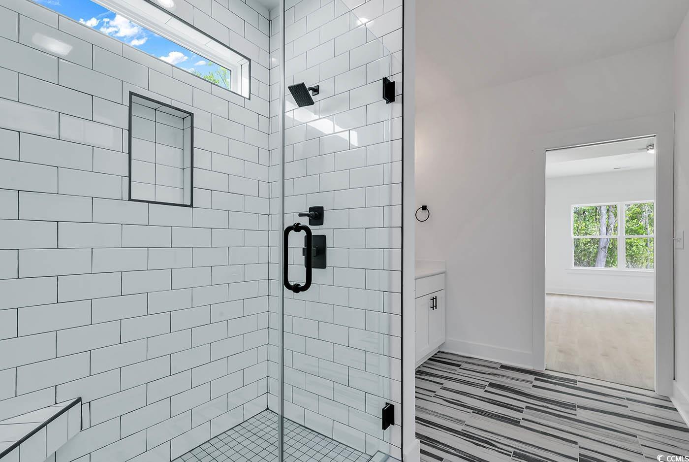 318 Dunbarton Lane Conway, SC 29526 - Photo 23 of 33 Master Bathroom with a tiled shower with frameless