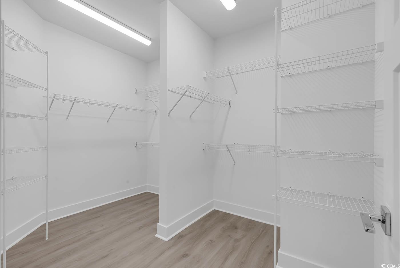 318 Dunbarton Lane Conway, SC 29526 - Photo 24 of 33 Spacious walk-in closet with wood laminate floorin