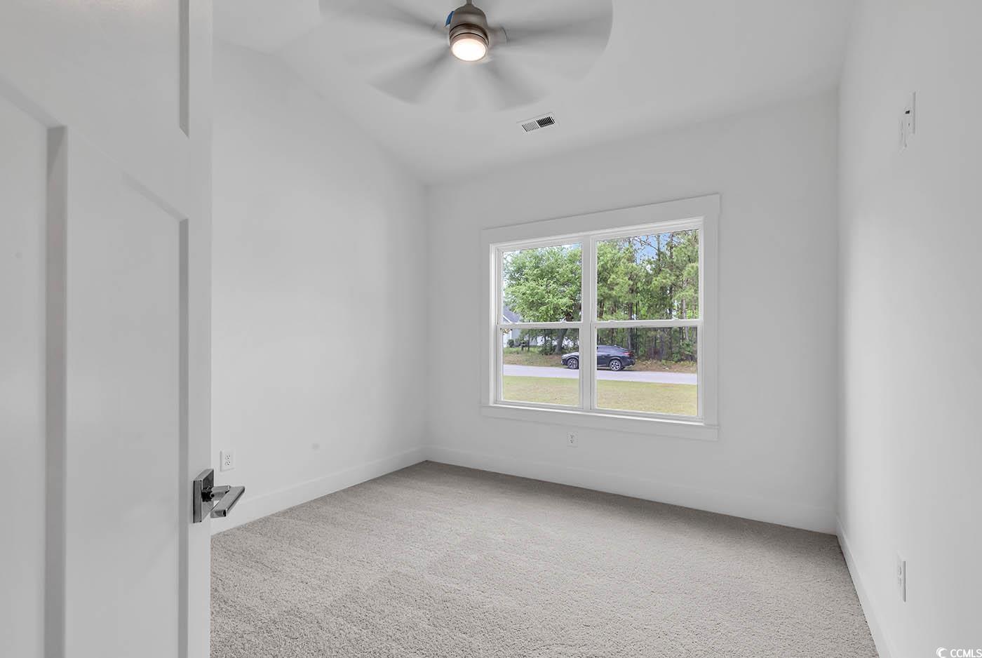 318 Dunbarton Lane Conway, SC 29526 - Photo 25 of 33 Bedroom with ceiling fan, carpet flooring.