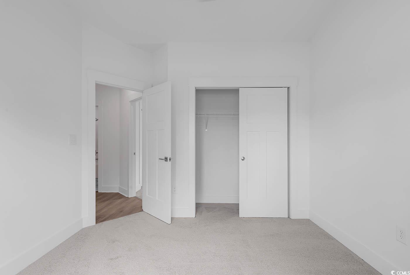 318 Dunbarton Lane Conway, SC 29526 - Photo 26 of 33 Bedroom featuring carpet flooring and a closet.