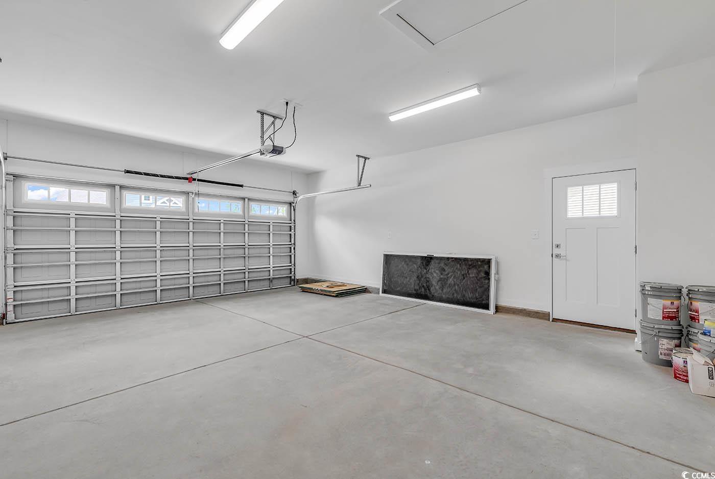 318 Dunbarton Lane Conway, SC 29526 - Photo 33 of 33 Garage featuring a service door, a garage door wit