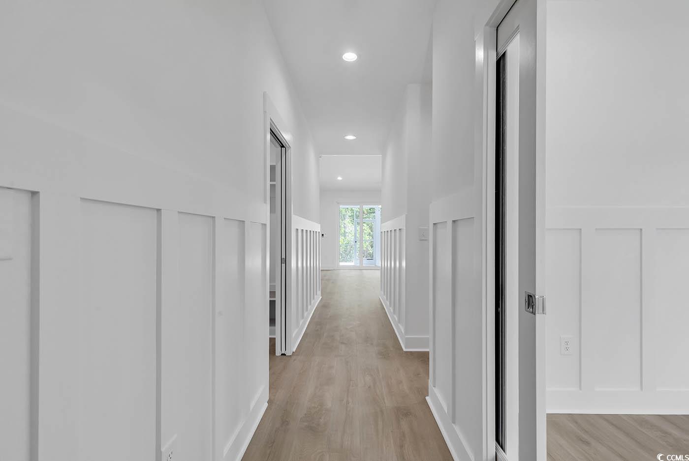 318 Dunbarton Lane Conway, SC 29526 - Photo 4 of 33 Hall with wainscoting, light wood-type flooring