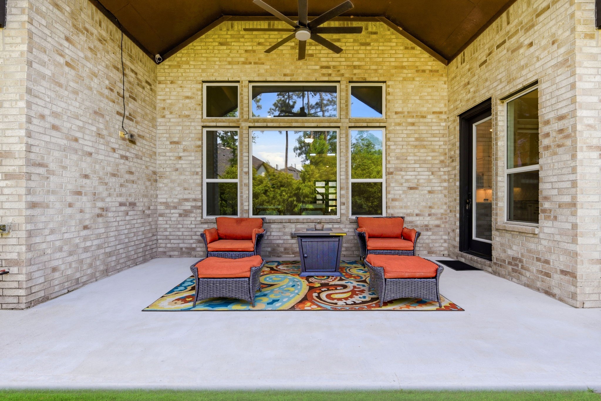 10062 South Goshawk Trail Conroe, TX 77385 - Photo 37 of 43 a backyard of a house with seating space