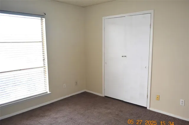 a view of a room that has a window in it