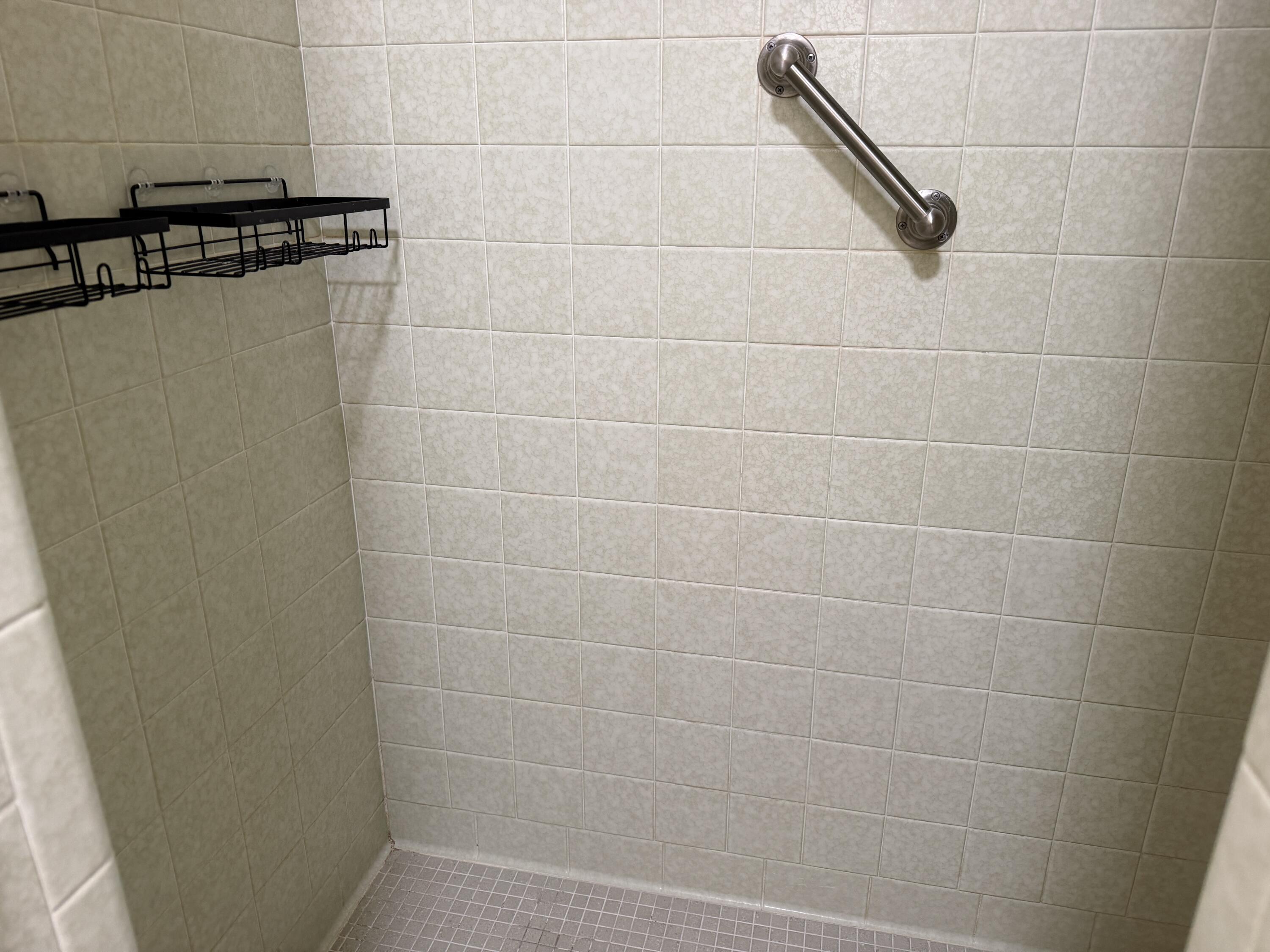 1603 South 8th Street Lamesa, TX 79331 - Photo 19 of 39 a bathroom with a shower and a sink