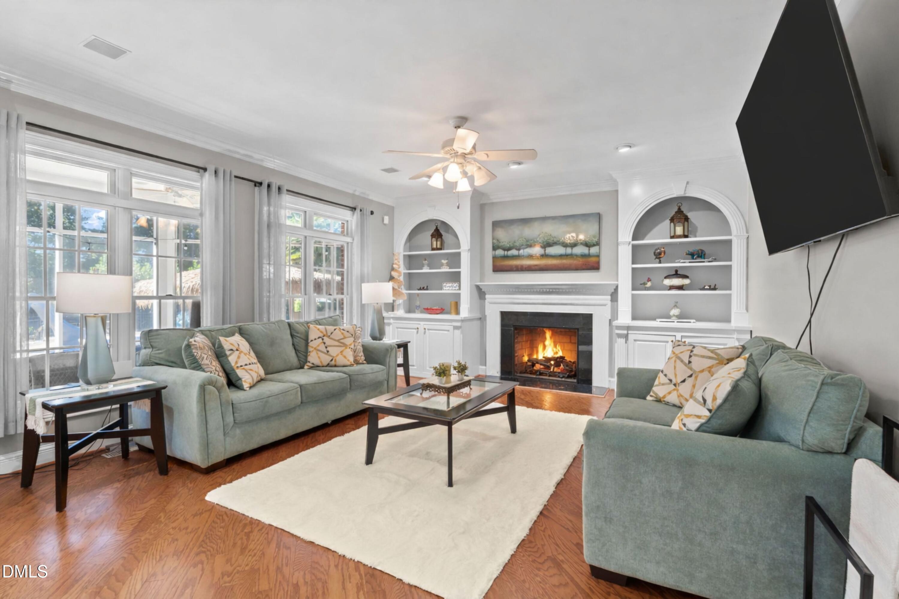 5870 Hoyt Road Middlesex, NC 27557 - Photo 2 of 33 a living room with furniture a large window and a fireplace