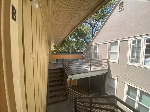 a view of a balcony with an outdoor space