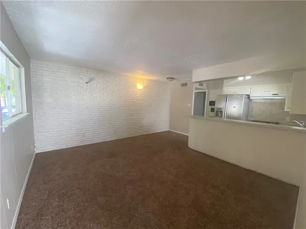a view of a kitchen with a sink