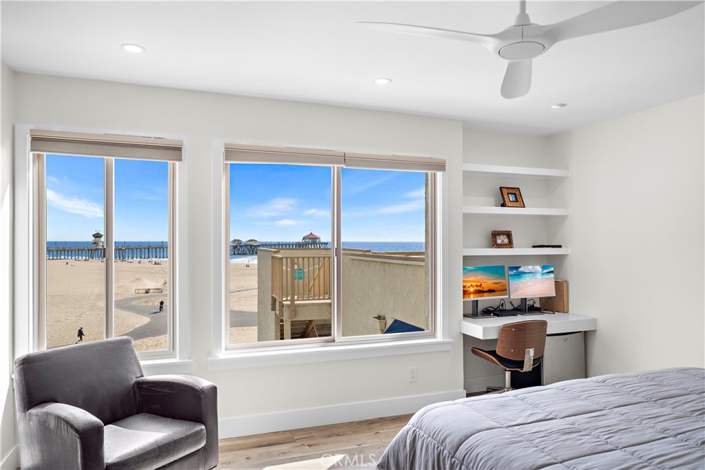 711 Pacific Coast Highway, Unit 330 Huntington Beach, CA 92648 - Photo 3 of 54 a bedroom with a bed and a large window with the outer view