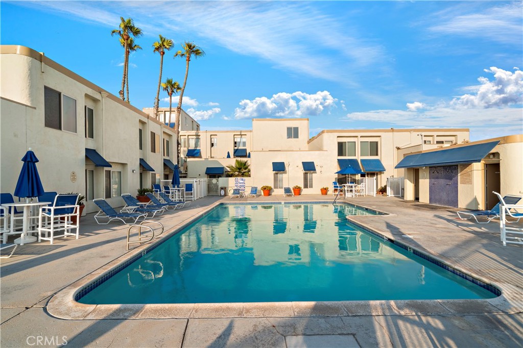 711 Pacific Coast Highway, Unit 330 Huntington Beach, CA 92648 - Photo 37 of 54 a view of a house with a swimming pool