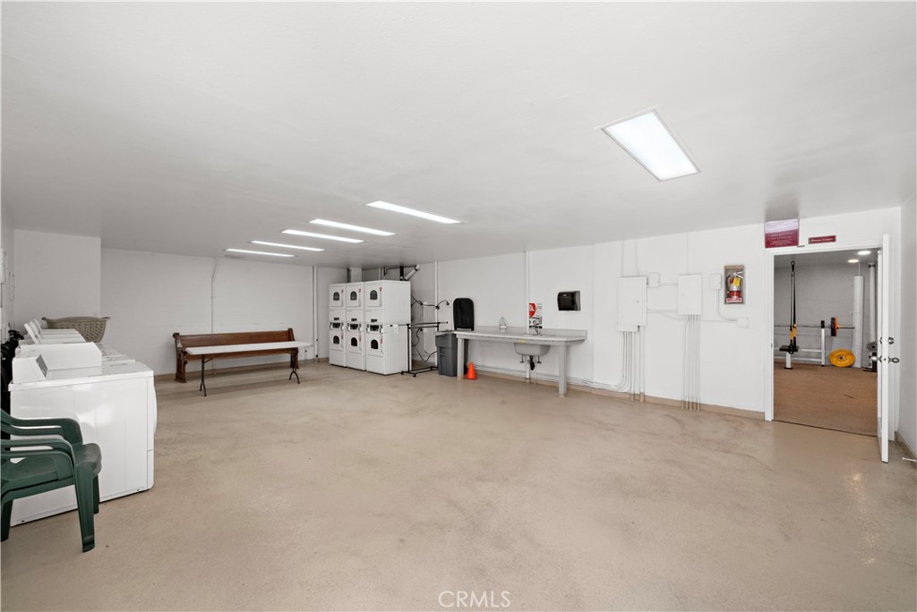 711 Pacific Coast Highway, Unit 330 Huntington Beach, CA 92648 - Photo 42 of 54 a view of a livingroom with furniture and toys