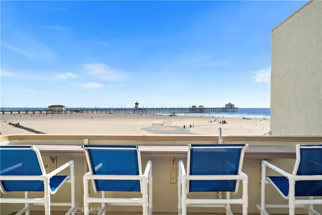 a view of a swimming pool with outdoor seating and yard