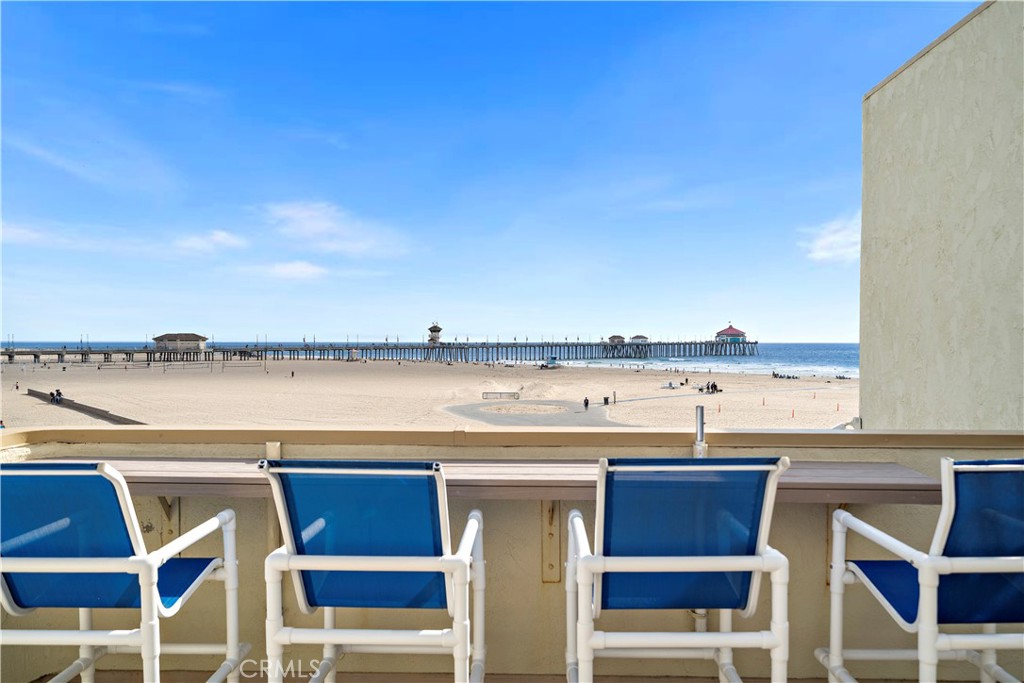 711 Pacific Coast Highway, Unit 330 Huntington Beach, CA 92648 - Photo 6 of 54 a view of a swimming pool with outdoor seating and yard