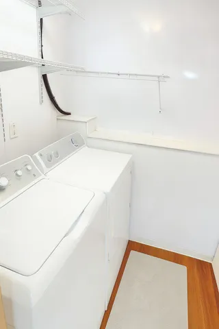 a utility room with a shower and dryer