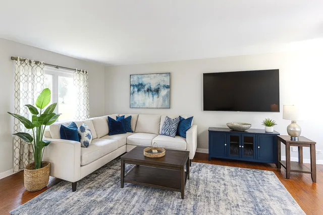 a living room with furniture and a flat screen tv