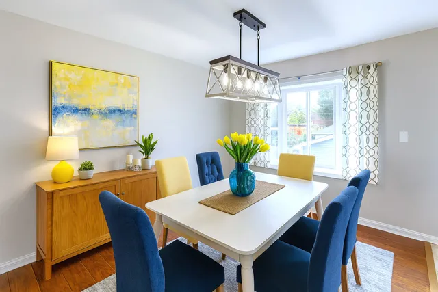 a view of a dining room with furniture and window