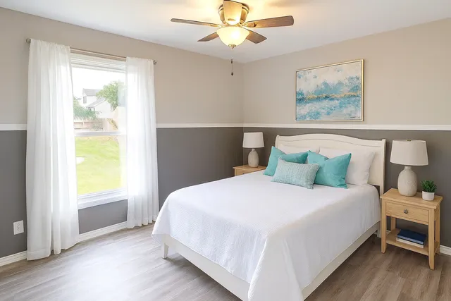 a bedroom with a bed and a window