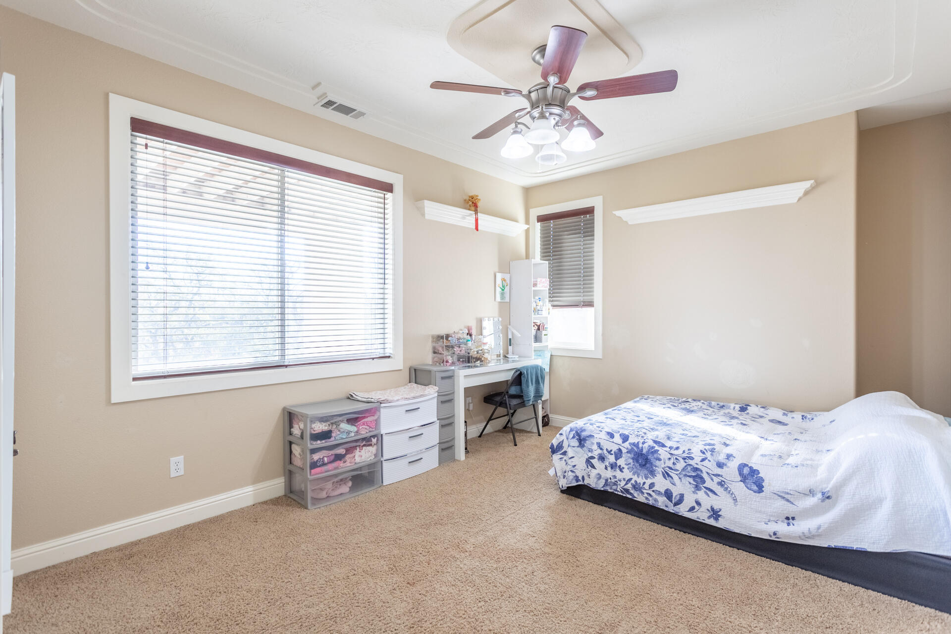 7775 Muletown Road Redding, CA 96001 - Photo 32 of 46 a bedroom with a bed and a chandelier