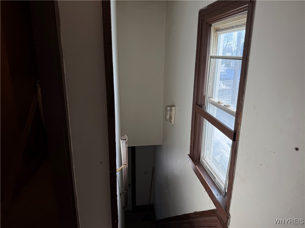 1816 Military Road Tonawanda, NY 14217 - Photo 14 of 15 Stairs going down from the living room to the fron