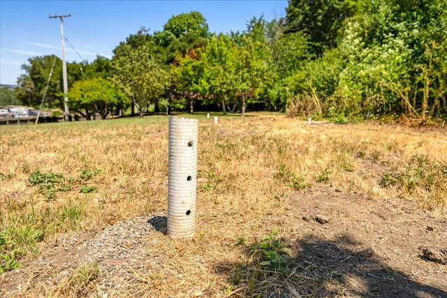 a view of outdoor space with deck and yard