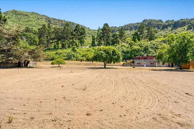 an aerial view of a house with a garden