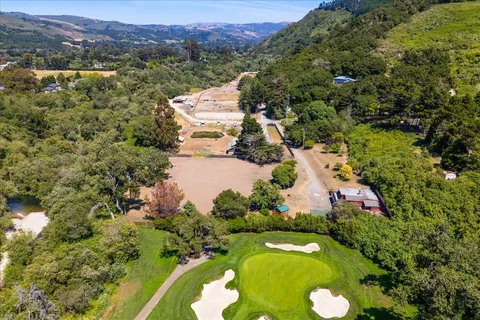 a street sign that is sitting in the middle of a house